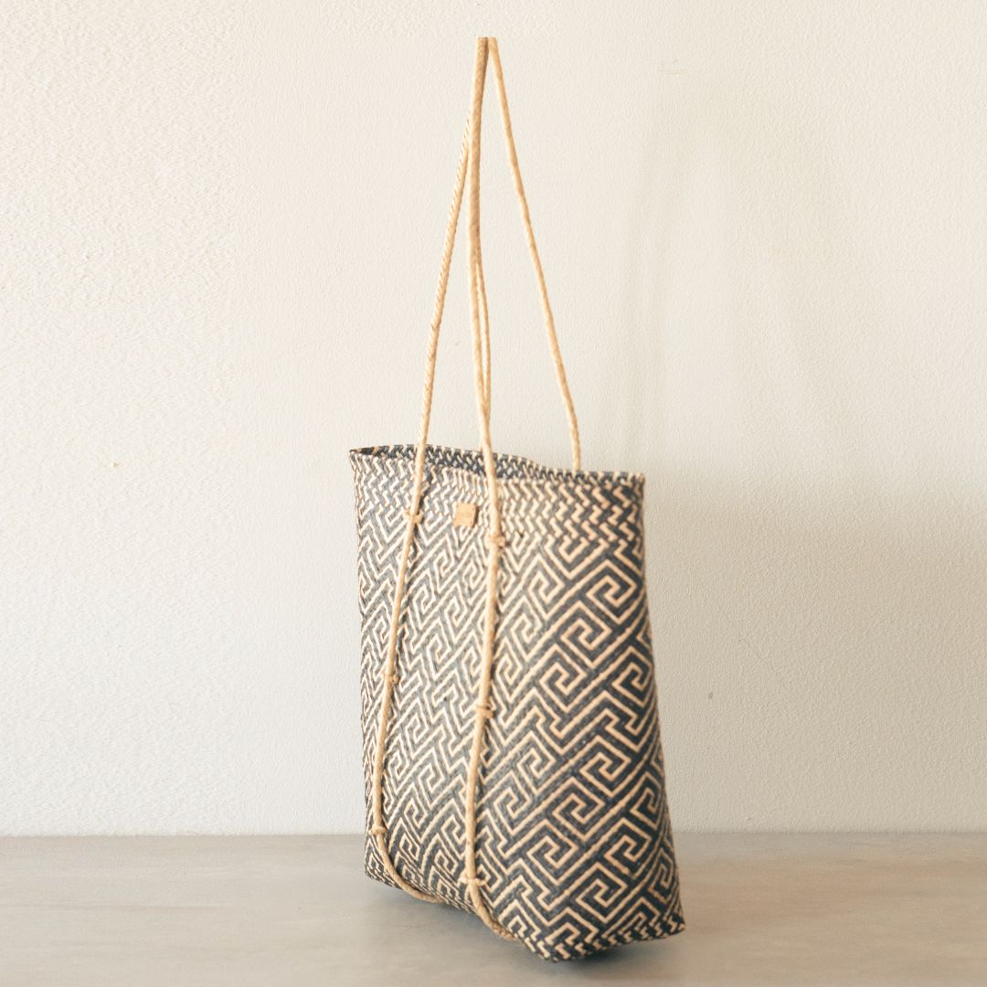 Handmade rattan straw shoulder bag suitable for summer boho chic style with black and white colour and ethnic pattern