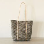 Handmade rattan straw shoulder bag suitable for summer boho chic style with black and white colour and ethnic pattern