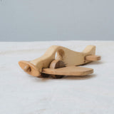 Handmade Wooden Plane Toy for kids aged 3+, crafted with a natural pine body and teak wood wings, featuring smooth edges and a unique two-tone design