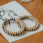 Angel loop rattan earring in beige and black, handcrafted eco-friendly artisan jewellery