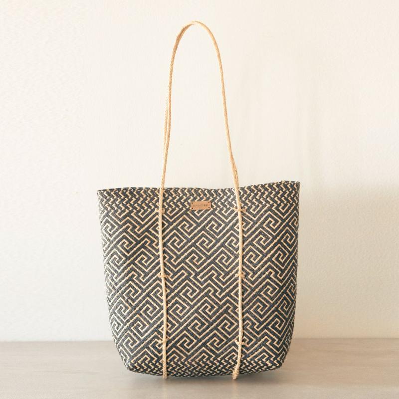 Handmade rattan straw shoulder bag suitable for summer boho chic style with black and white colour and ethnic pattern