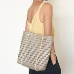 Anya Handwoven Rattan Shoulder Bag, a lightweight and durable summer bag crafted from natural rattan, featuring a stylish zigzag pattern and long handles, handwoven by women artisans in Borneo, Indonesia. Ideal for beach trips or as a work bag, capable of holding up to 3kg