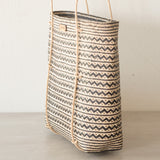 Anya Handwoven Rattan Shoulder Bag, a lightweight and durable summer bag crafted from natural rattan, featuring a stylish zigzag pattern and long handles, handwoven by women artisans in Borneo, Indonesia. Ideal for beach trips or as a work bag, capable of holding up to 3kg